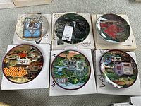 Six Bradford Exchange collector plates shown inside their original white boxes, each plate depicting various Americana themes such as historic buildings, farms, and rural landscapes.