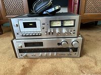 Stacked Sony TC-199SD cassette deck above Sony STR-4800SD receiver with coiled cable headphones on top.