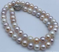 Close-up of multicoloured round pearls showing luster and size