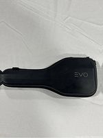 Closed black molded hard-shell carrying case with EVO logo embossed on top, designed to protect and store the gimbal.