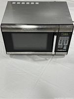 Front view of the Cuisinart microwave oven showing control panel, door, and overall exterior condition