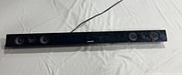 Front view of black Samsung soundbar showing multiple speaker drivers and Samsung logo