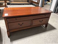 Front view showing four drawers and bail handles