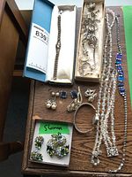 Faceted clear crystal bead necklace and silver-tone necklace with blue rectangular glass links