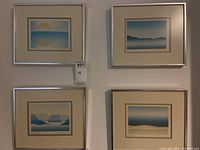 Full view of four framed silkscreen prints arranged in 2x2 grid, showing titles and color palette.