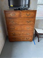 Front view of dresser showing six drawers and metal handles