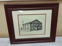 Framed pen and ink artwork of Old Hay Bay Church fully captured straight on.