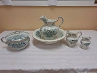 Full view of the 6-piece porcelain wash set showing all items arranged on a white cloth surface.