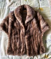 Front view of the short brown mink fur coat showing the collar and short sleeves.