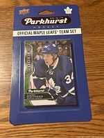 Front view of 2016-17 Upper Deck Parkhurst Maple Leafs hockey card team set with Auston Matthews rookie card enclosed in original cardholder packaging.