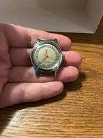 Front view showing watch face with brand name 'Nibo' visible, dial details, and crown.