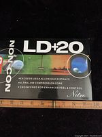 Box of LD+20 Nitro golf balls showing front with features and branding