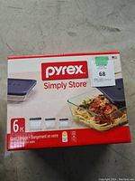 Photo of the Pyrex Simply Store 6-piece glass storage containers box showing it is brand new and sealed.