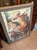 Photo showing the framed print of the Libyan Sibyl from Michelangelo's Sistine Chapel artwork with a green price tag visible.