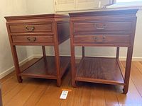 Front view of both matching side tables on wood floor