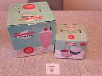 Photo of both boxes showing the 'Summer Treats' brand with vintage-style packaging, the milkshake glasses box on left and ice cream bowls box on right.