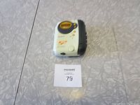 Sony Walkman WM-FS555 portable cassette player on a surface with a lot number placard.