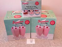Two boxes of four milkshake glasses each and one box of six ice cream bowls still in packaging.