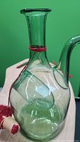 Green glass decanter showing the bulb and overall shape