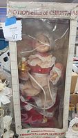 Front view of Mrs Claus figure in original box showing full body and packaging