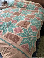 Full view of the textile cover draped over a sofa showing overall design and size.