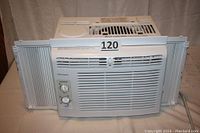 Front view of the Frigidaire 5000 BTU window air conditioner showing the front grille, side panels, and control knobs.