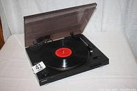 Sony PS-LX250H automatic turntable system with dust cover open and record on platter.