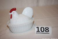 Photo of vintage Westmoreland milk glass hen on nest covered dish showing the whole item and chip on comb