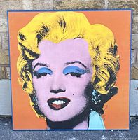 Front view of the lithograph featuring Marilyn Monroe in bright colors on orange background.