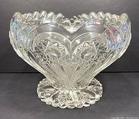 Front view of the clear glass pattern bowl showing prominent heart and starburst designs.