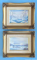 Pair of two small framed oil paintings. Top painting shows snowy winter landscape with birch trees and a stream. Bottom painting shows ocean waves crashing with birds in the sky. Both in gold ornamental frames with cream and gold matting.