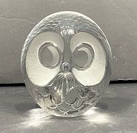 Front view of vintage Mats Jonasson lead crystal owl paperweight showing detailed facial features and polished clear and frosted finish.
