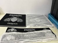 Overview of 2 large square mats and 3 smaller spill mats, some in fabric protective sleeves