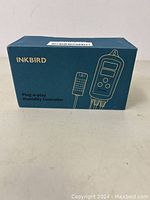 Blue Inkbird box front and side showing product name and image of humidity controller device with sensor probe.
