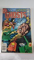 Front cover of Electronic Ghosts #1 comic book showing colorful horror-themed artwork with a man and robots, priced 60 cents.