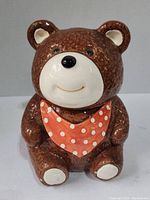 Front view of the bear cookie jar showing the face, bib and textured fur detail.