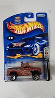 1966 Ford Bronco Hot Wheels toy car sealed in original blue Hot Wheels blister pack with flame graphics