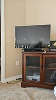 Sony 32 inch Bravia TV on wooden cabinet