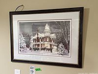 Full view of framed Walter Campbell winter scene print depicting a Victorian house with horses and sleighs in snow.