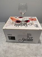 Box of 12 Libbey Sociable wine glasses with one glass displayed on top.