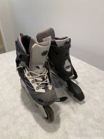 Front angle view of men's size 10 roller blades showing design and condition.