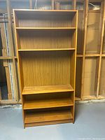 Full view of the six-foot wooden bookcase