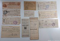 Photo with assortment of cheques, receipts, and formal documents including a bond of land certificate.