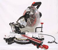 Front angle view of Craftsman 10 inch sliding compound miter saw showing blade, guard, base, and extensions with the power cord.