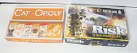 Photo showing the boxes of Cat-Opoly and Doctor Who Risk games side by side.