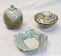 Group photo showing three pottery pieces: pentagon bowl with stripes, round bud vase with green and beige tones, and Japanese rice bowl with lid.