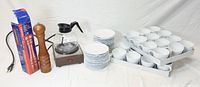 Full lot showing coffee pot, warmer, cups, saucers, and pepper mill