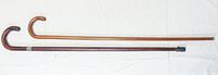 Photo of both walking sticks laid side by side showing length and handle styles.