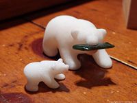 White marble hand sculpted mother and cub polar bear figurines, mother holding jade fish