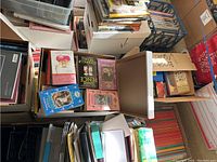 Box with assorted books including titles on Egypt, Joanne Pence, Claudia Bishop, among others